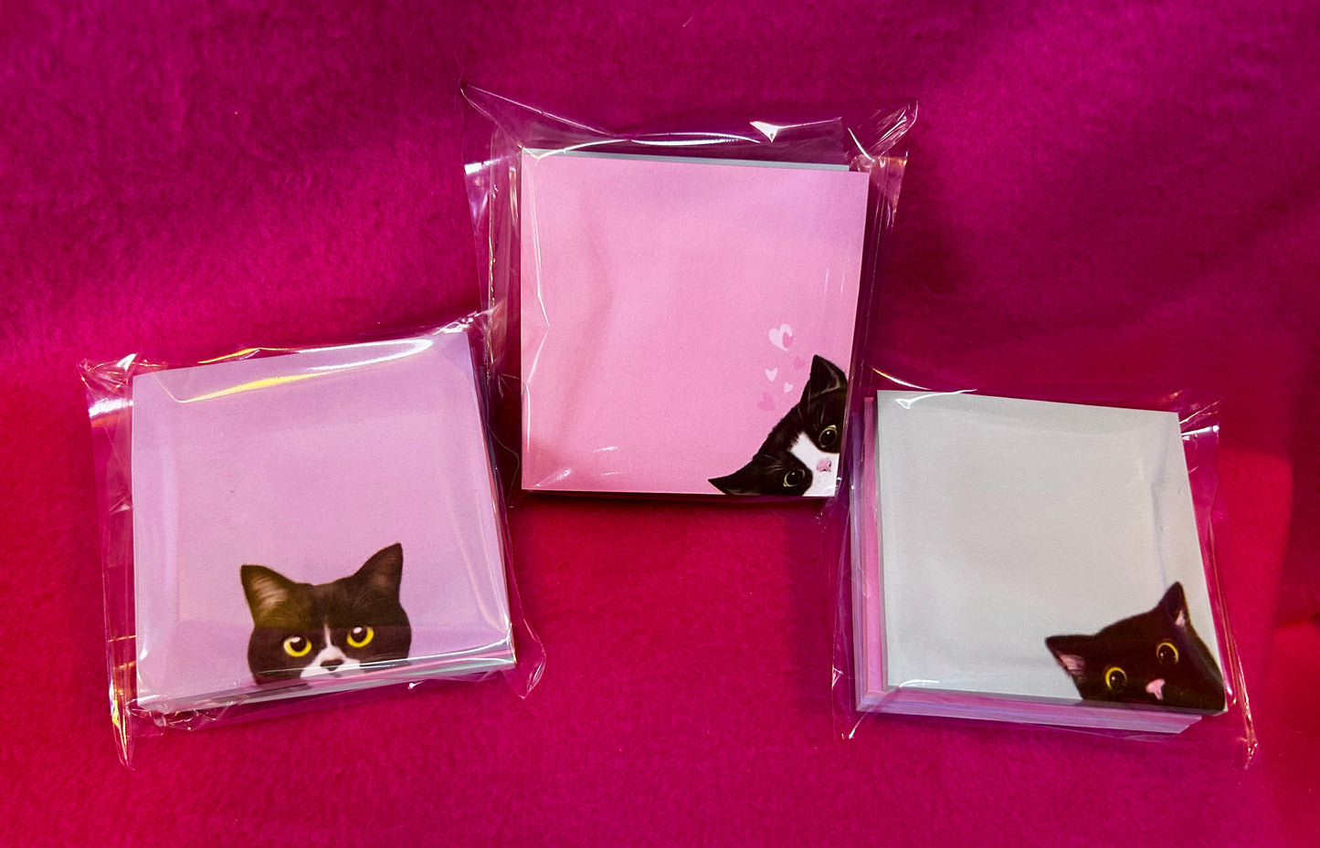 cat peeking sticky notes